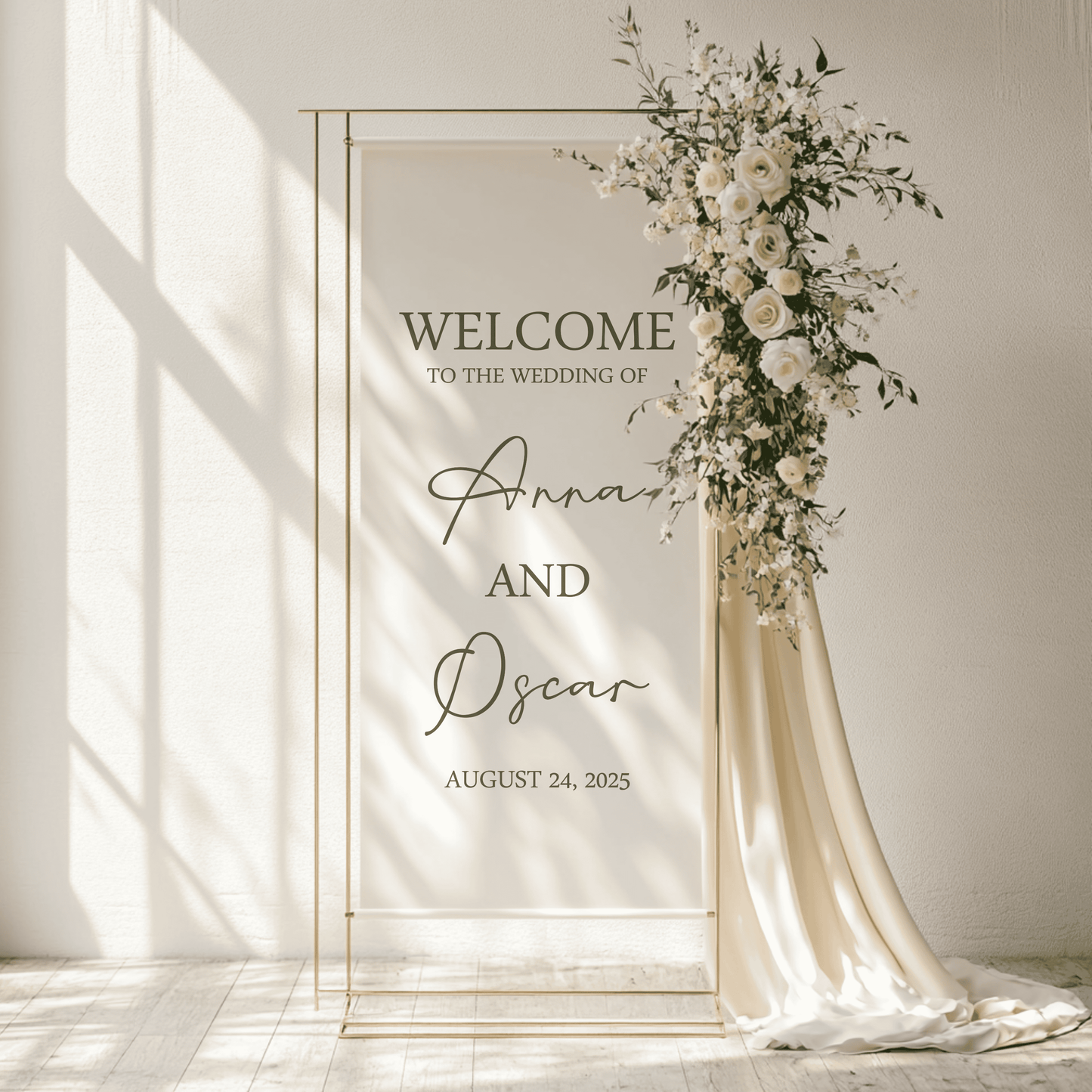 Wedding welcome arch with floral decorations and personalized text on a fabric linen sign