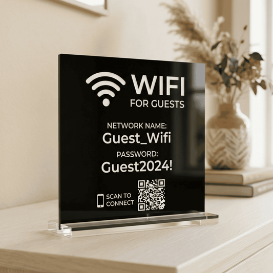 Black sign with WiFi information on a clear stand, placed on a surface.
