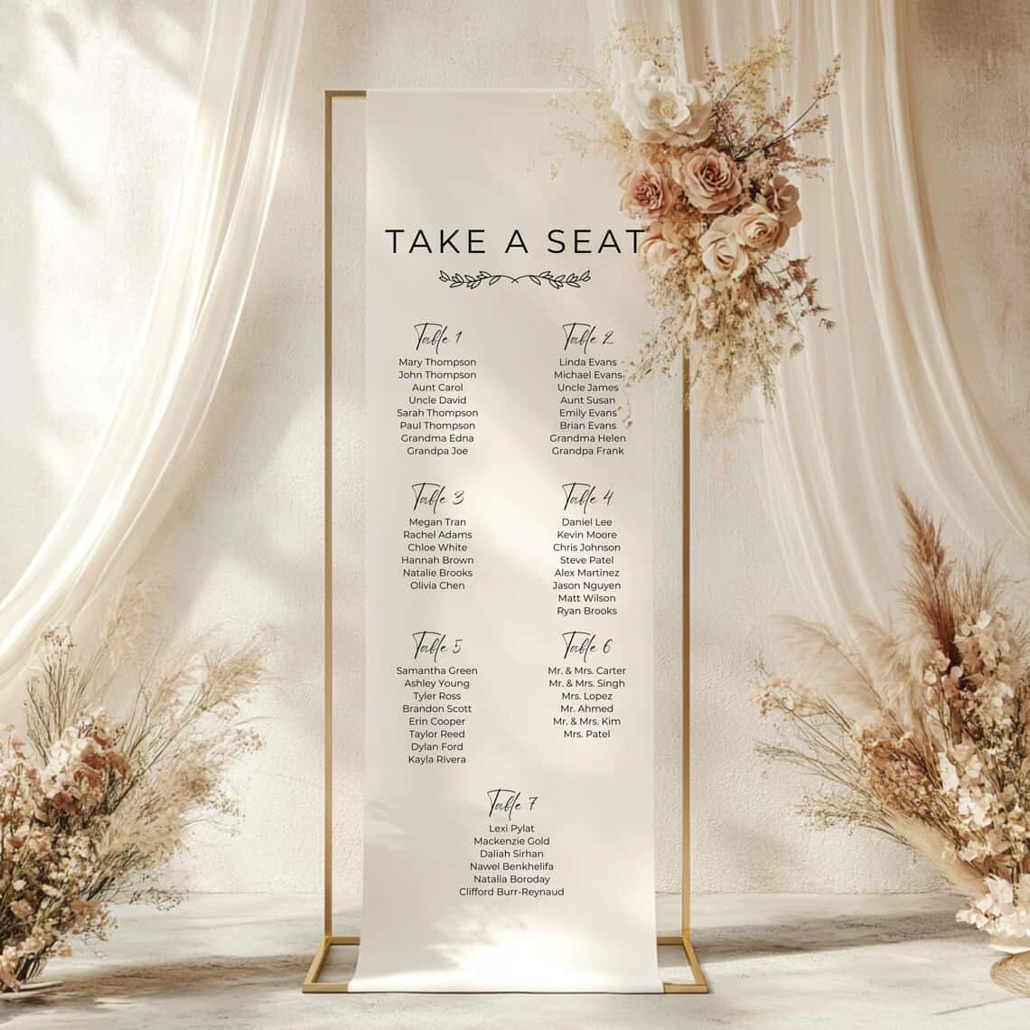 Decorative seating chart for a wedding with floral arrangements on a white background