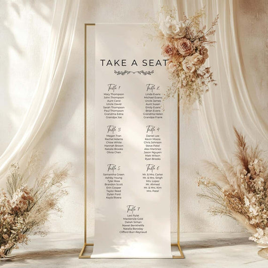 Decorative seating chart for a wedding with floral arrangements on a white background
